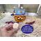 This pumpkin gourd comes with a battery-operated candle to light up her happy face.